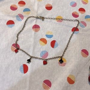 Faux gold card suits choker